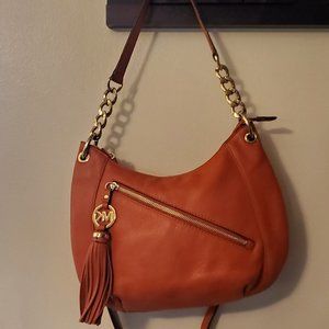 Orange leather Michael Kors handbag.